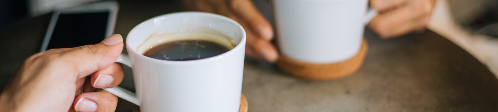 People having coffee together.